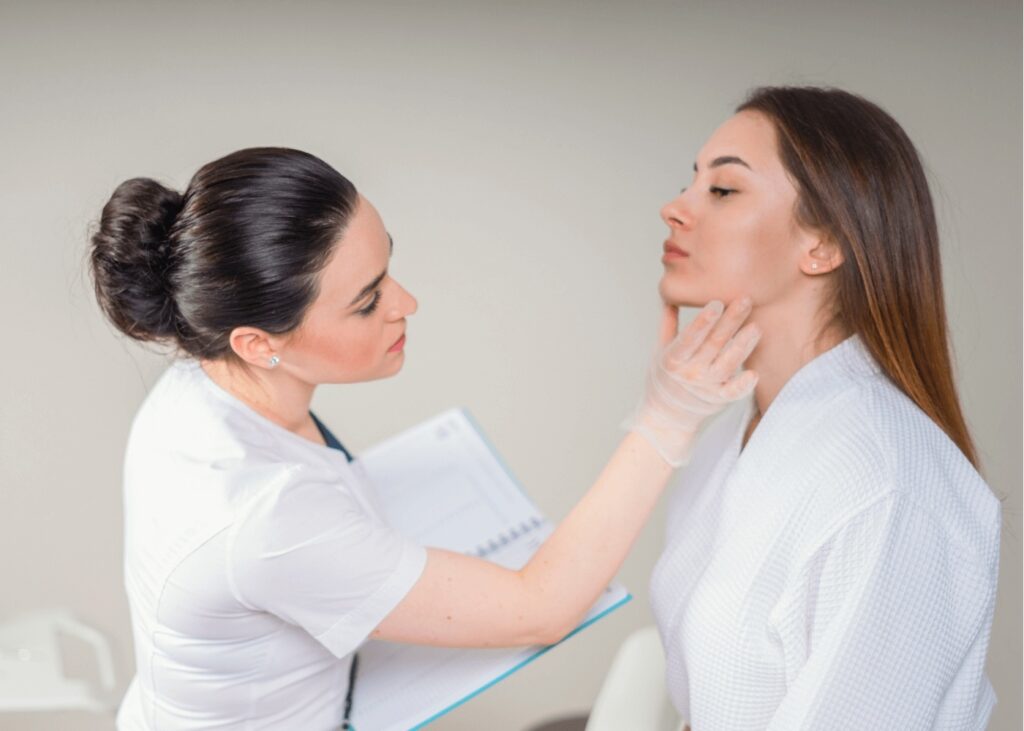 Dermatologist examining patient's skin in medical office in New Lenox